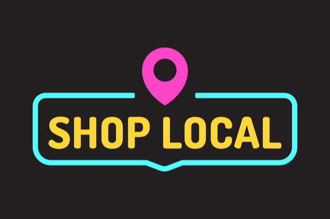 neon sign that reads shop local