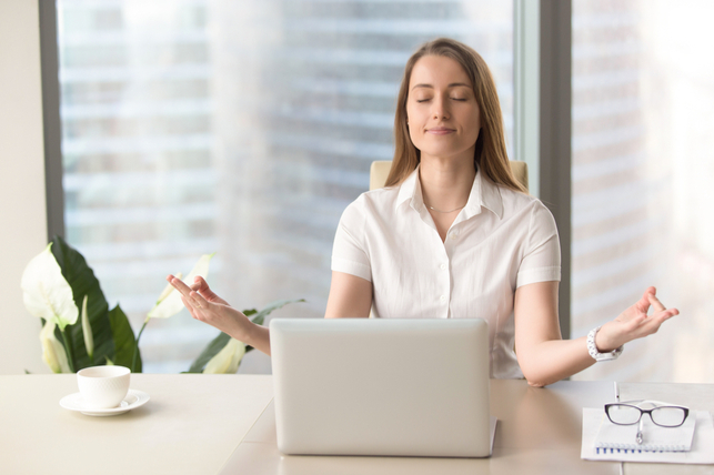 woman relaxing at her desk