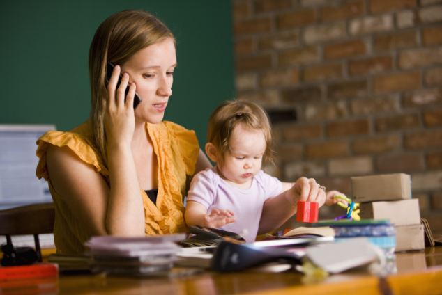 Mother searches for a dentist using her mobile phone